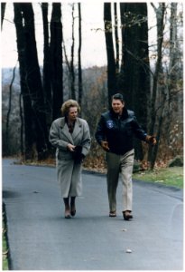 Photograph of President Reagan walking with Prime Minister Margaret Thatcher at Camp David - NARA - 198578