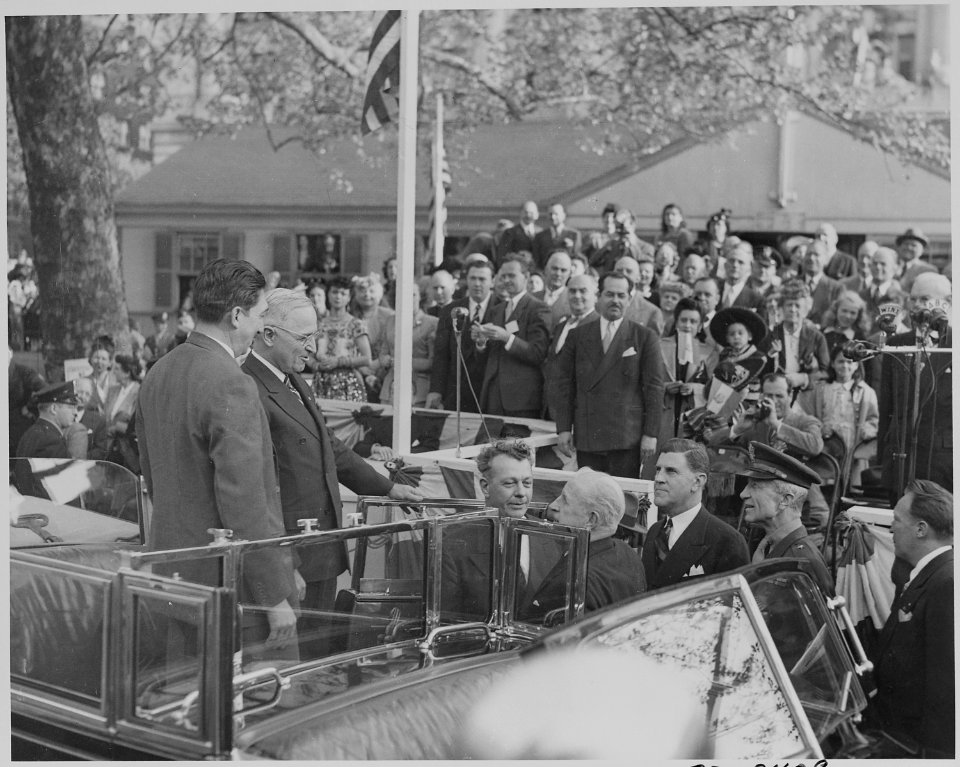 Photograph of President Truman and Mexican President Miguel Aleman greeting dignitaries during welcoming ceremonies... - NARA - 199564