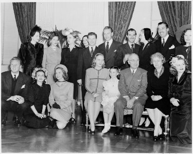 Photograph of movie stars posing with President Truman and his family at the White House, (front row, left to right)... - NARA - 199330