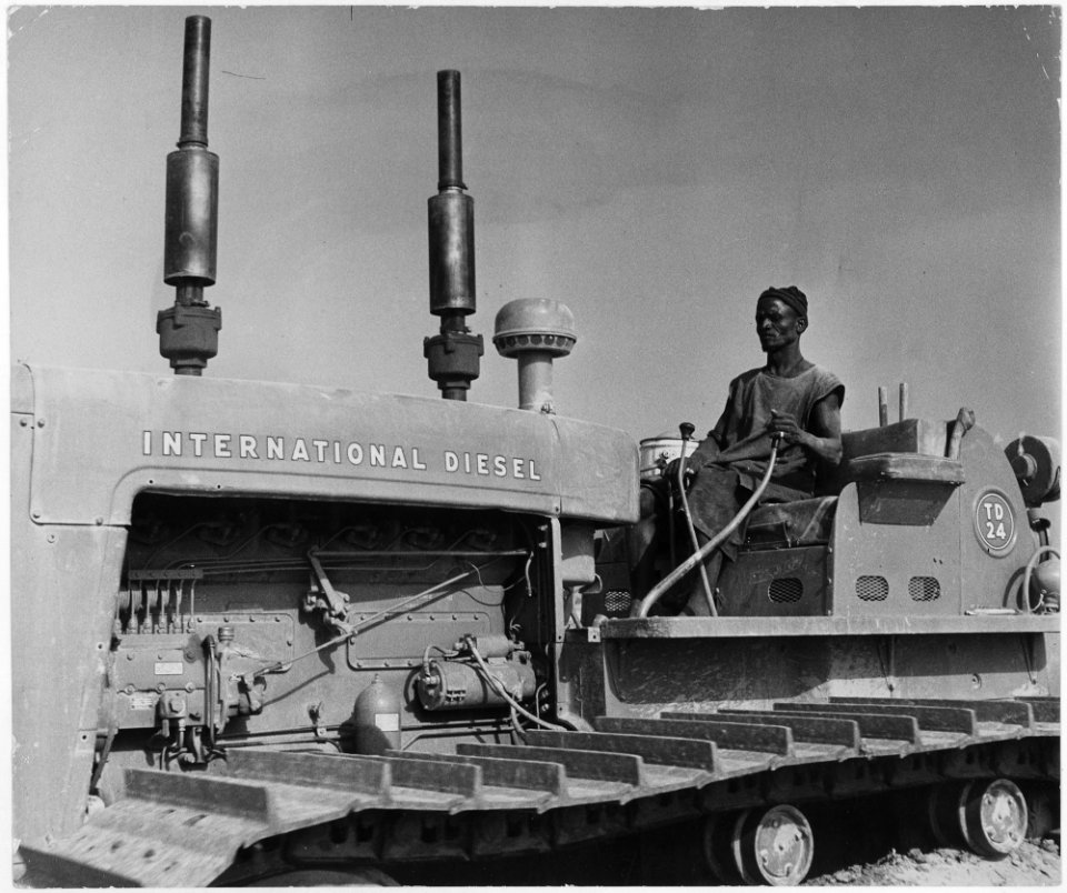 Photograph of Native Worker in French West Africa Operating Machinery - NARA - 541634