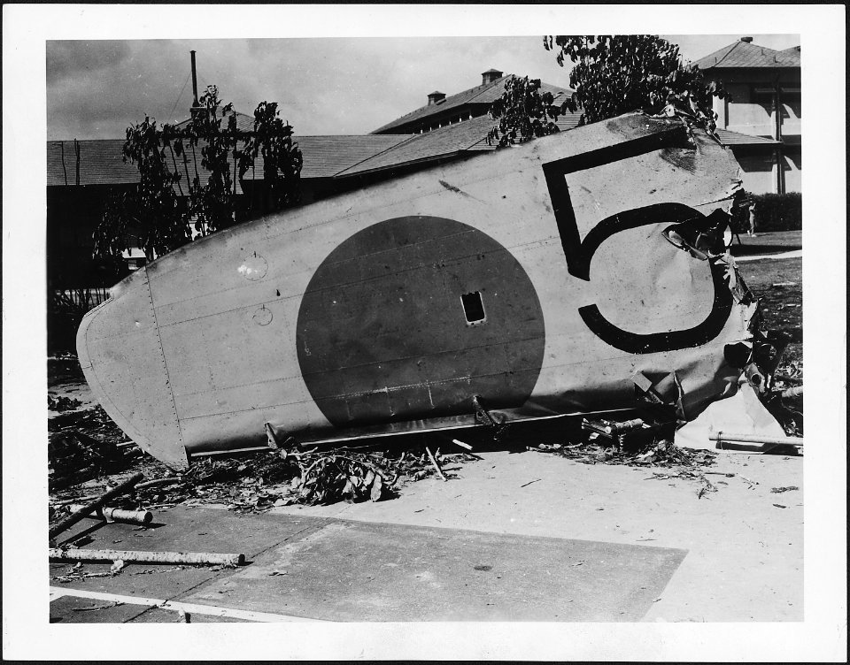 Photograph of a wing from a Japanese bomber shot down on the grounds of the Naval Hospital, Honolulu, Territory of... - NARA - 306539