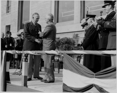 Photograph of President Truman shaking hands with General George C. Marshall as he presents him with an Oak Leaf... - NARA - 199268