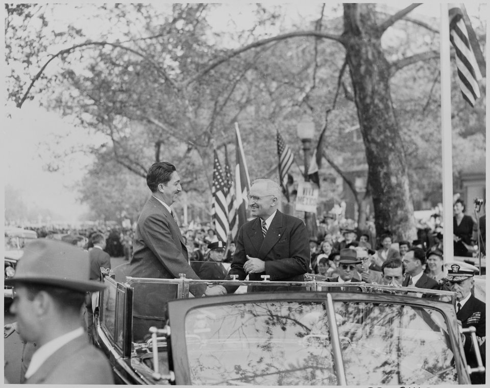 Photograph of President Truman shaking hands with Mexican President Miguel Aleman during a welcoming ceremony at the... - NARA - 199558