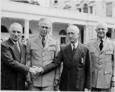 Photograph of President Truman shaking hands with Secretary of State James F. Byrnes after awarding him the... - NARA - 199180