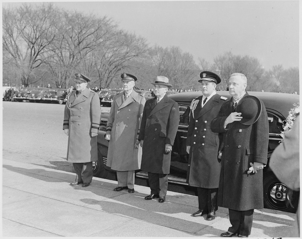 Photograph of President Truman standing beside his car with military officers (including his Military Aide, General... - NARA - 199503