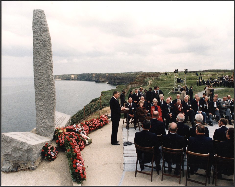 Photograph of President Reagan giving a speech on the 40th Anniversary of D-Day at Pointe du Hoc, Normandy, France - NARA - 198549