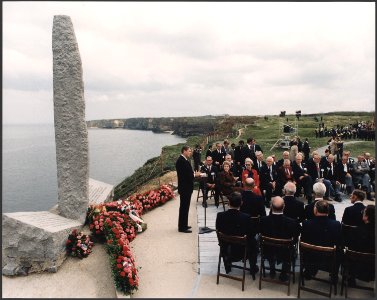 Photograph of President Reagan giving a speech on the 40th Anniversary of D-Day at Pointe du Hoc, Normandy, France - NARA - 198549