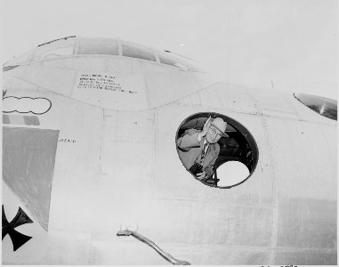 Photograph of President Truman waving from inside a B-36A bomber, at an air show at Andrews Air Force Base. - NARA - 200090