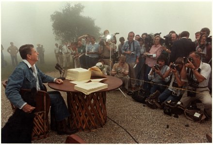 Photograph of President Reagan meeting with the Press after signing the Tax Reconciliation Bill, Rancho Del Cielo - NARA - 198520