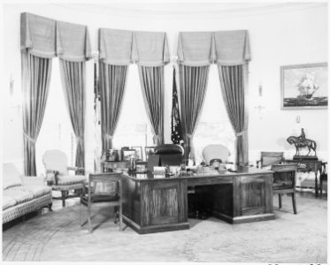 Photograph of President Truman's desk and Oval Office in the White House. - NARA - 199444 photo