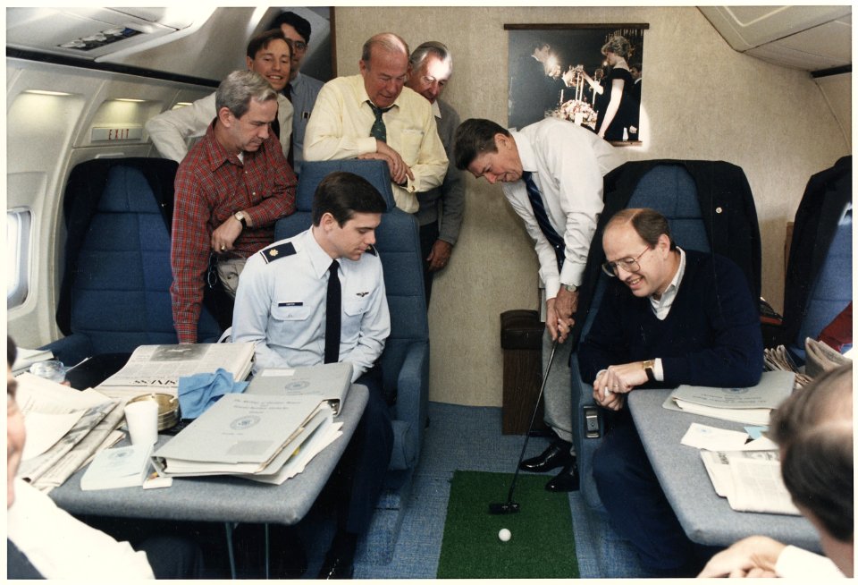 Photograph of President Reagan putting a golf ball around Air Force One - NARA - 198571