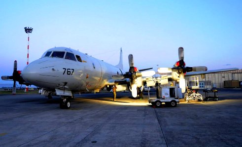 Photo of Patrol Squadron 47 working on a P-3 aircraft