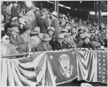 Photograph of President Truman and other officials in the stands at Griffith Stadium in Washington, for the opening... - NARA - 199576