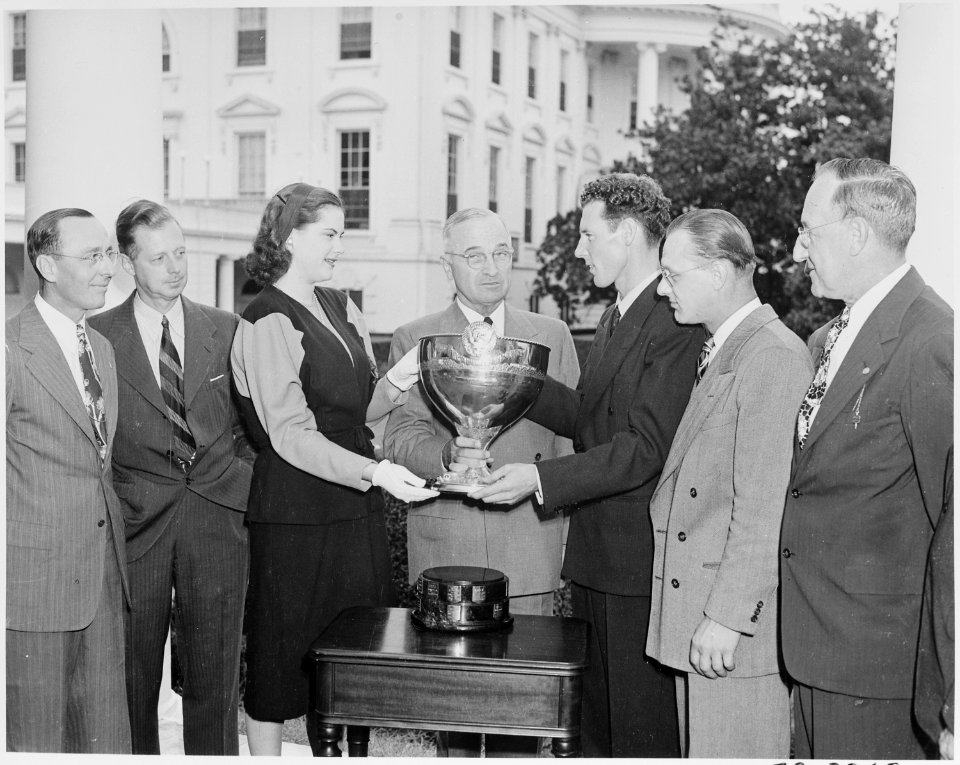 Photograph of President Truman and President's Cup Regatta Queen Drucie Snyder presenting the President's Cup to... - NARA - 199418