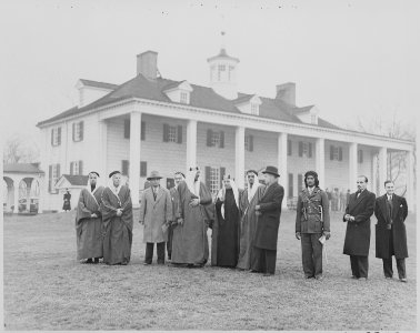 Photograph of Crown Prince Amir Saud of Saudi Arabia with other dignitaries, outside George Washington's house at... - NARA - 199528