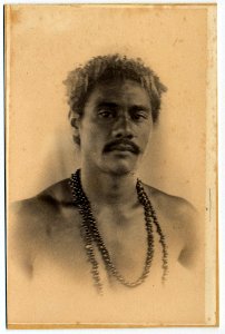 Photograph (black and white); a portrait of a man with a moustache; wearing a black beaded necklace around his neck; Albumen print. Oc,B18.3, British Museum