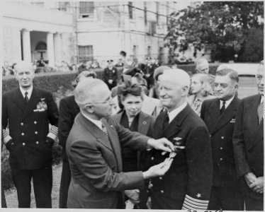 Photograph of President Truman decorating Admiral Chester Nimitz with a Gold Star (in lieu of a third Distinguished... - NARA - 199222