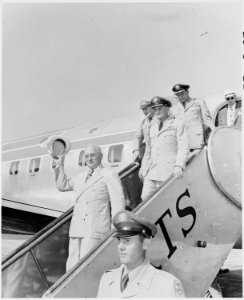 Photograph of President Truman disembarking from his airplane, The Independence, during a trip to Miami. - NARA - 200164