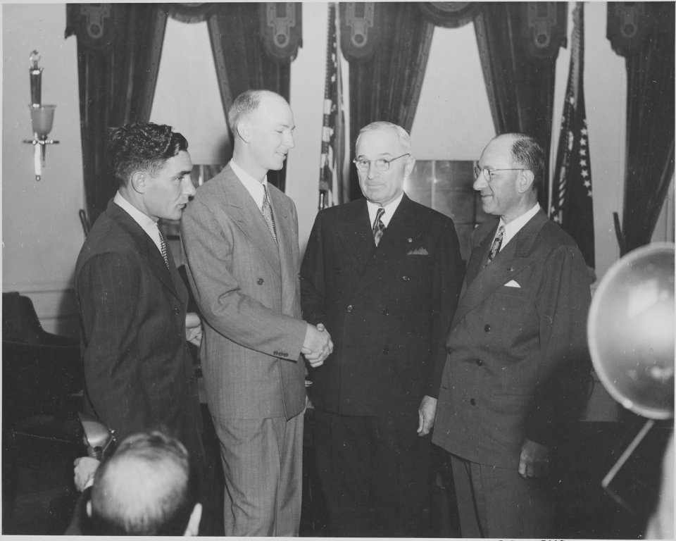 Photograph of President Truman greeting crew members from an around-the-world flight (Milton Reynolds, Captain... - NARA - 199588