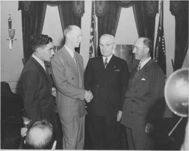 Photograph of President Truman greeting crew members from an around-the-world flight (Milton Reynolds, Captain... - NARA - 199588