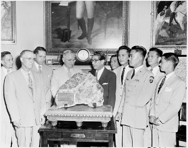 Photograph of President Truman in the Oval Office, accepting as a gift from the people of the Philippines a rock from... - NARA - 200335