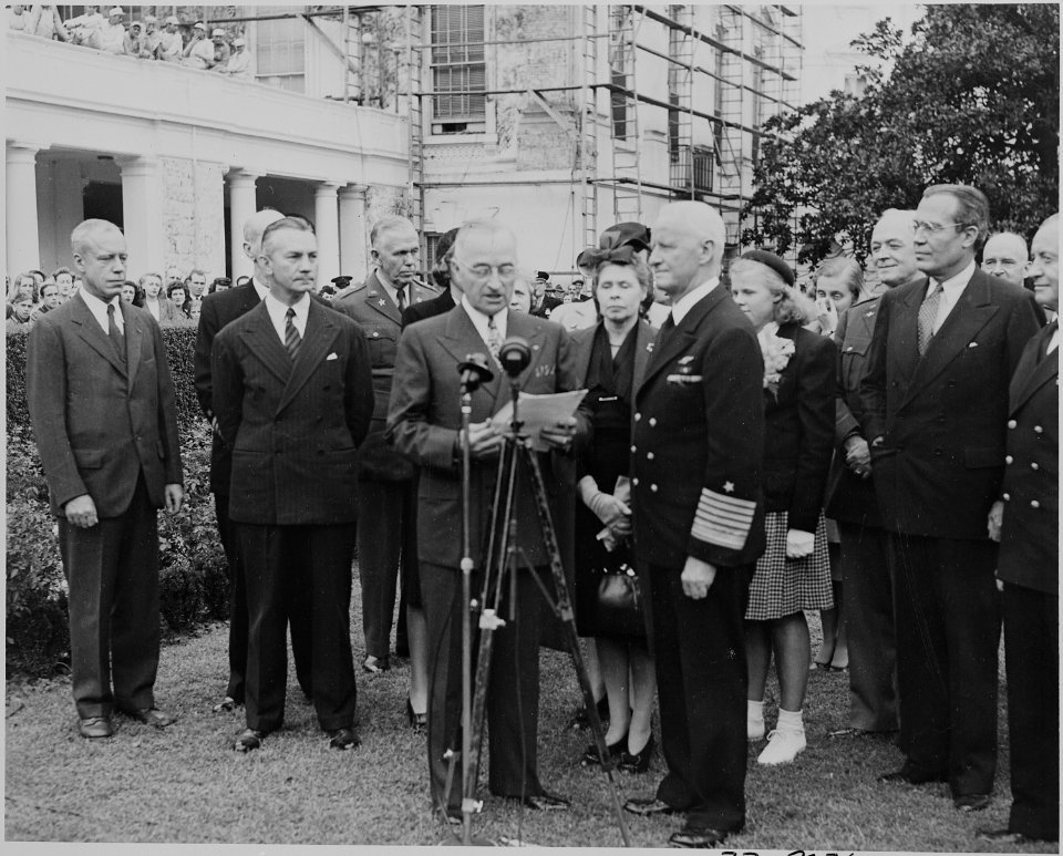 Photograph of President Truman reading the citation for Admiral Chester Nimitz's medal, as Secretary of the Navy... - NARA - 199225