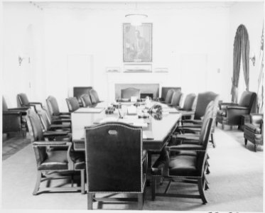 Photograph of the Cabinet Room in the White House, with a portrait of Woodrow Wilson over the mantelpiece. - NARA - 199449