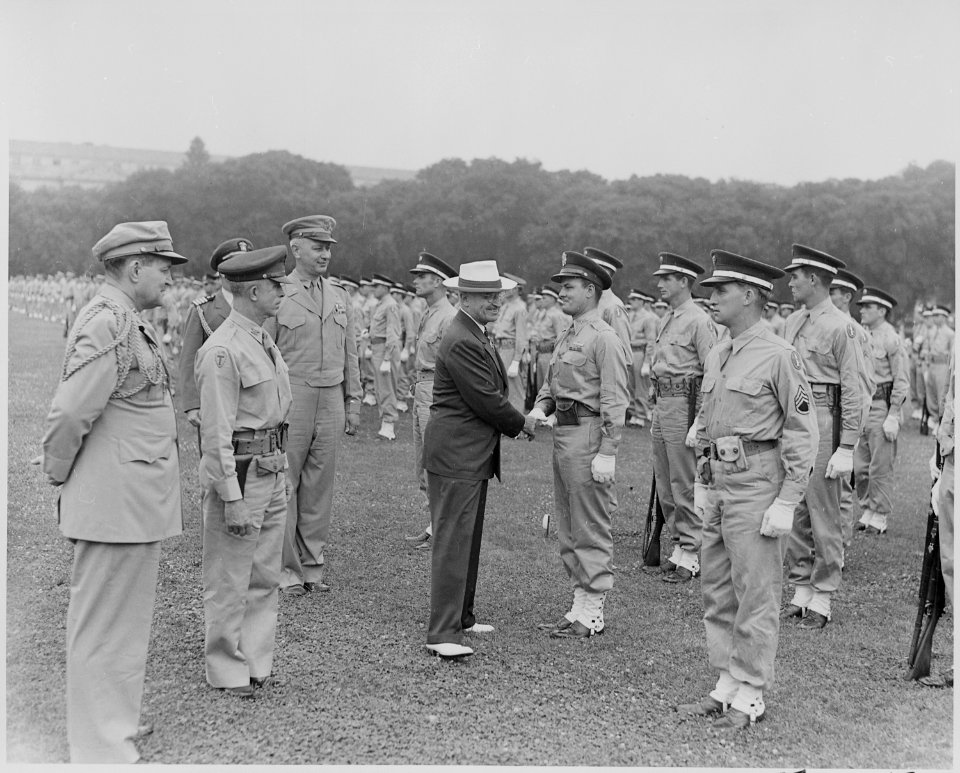 Photograph of President Truman shaking hands with a soldier as he reviews the military police of the District of... - NARA - 199384
