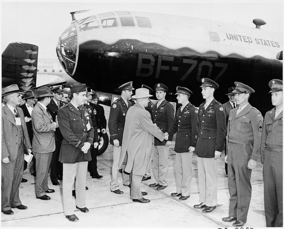 Photograph of President Truman shaking hands with Air Force personnel during an air show at Andrews Air Force Base. - NARA - 200089