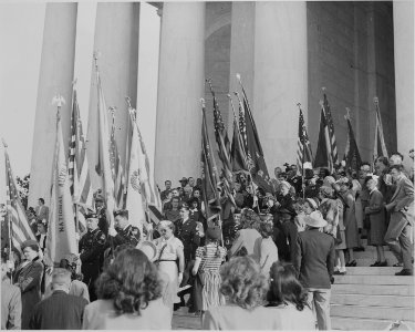 Photograph of flag-bearers and spectators at Jefferson Memorial ceremony marking Jefferson's birthday. - NARA - 199593 photo