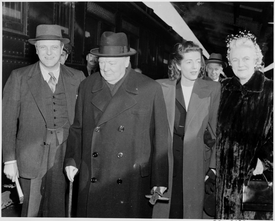 Photograph of former British Prime Minister Winston Churchill shortly after his arrival in the U.S., with members of... - NARA - 199348