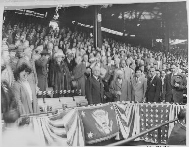Photograph of President Truman standing up in his box at Washington's Griffith Stadium, waiting to throw out the... - NARA - 199578