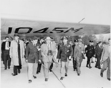 Photograph of President Truman with other dignitaries inspecting aircraft during an air show at Andrews Air Force Base. - NARA - 200088