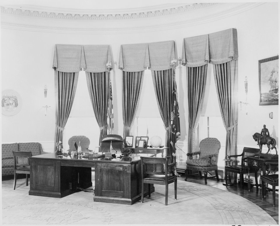 Photograph of President Truman's desk and other furnishings in the Oval Office of the White House. - NARA - 199460