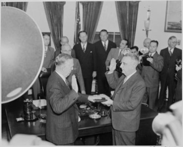 Photograph of George C. Marshall being sworn in as Secretary of State in the Oval Office by Chief Justice Fred... - NARA - 199520