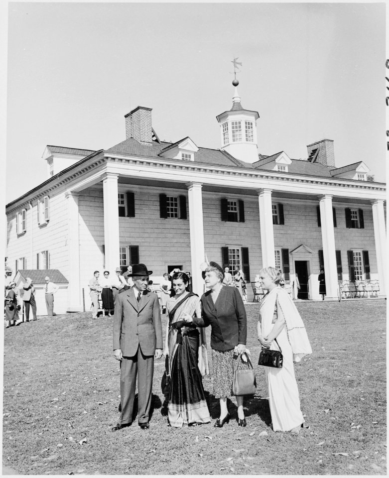 Photograph of Prime Minister Jawaharlal Nehru of India, with his sister and daughter, standing outside George... - NARA - 200155