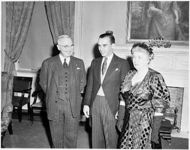 Photograph of the President and Mrs. Truman with Howard Mitchell, conductor of the National Symphony Orchestra, on... - NARA - 200133