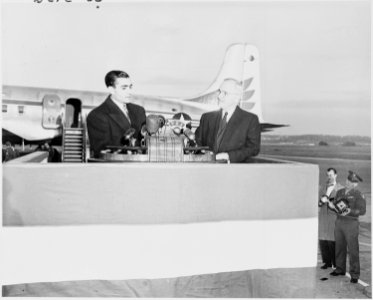 Photograph of the Shah of Iran speaking at Washington National Airport, during ceremonies welcoming him to the United... - NARA - 200143