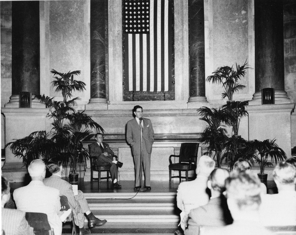 Photograph of Official Preview Freedom Train Exhibit- General Services Administration (GSA) Administrator Jess Larson speaking, Dr. Wayne C. Grover, Archivist of the United States, seated (18462090794)