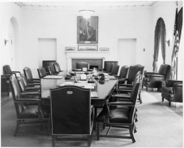 Photograph of the Cabinet Room of the White House, with a portrait of Woodrow Wilson over the mantelpiece. - NARA - 199467