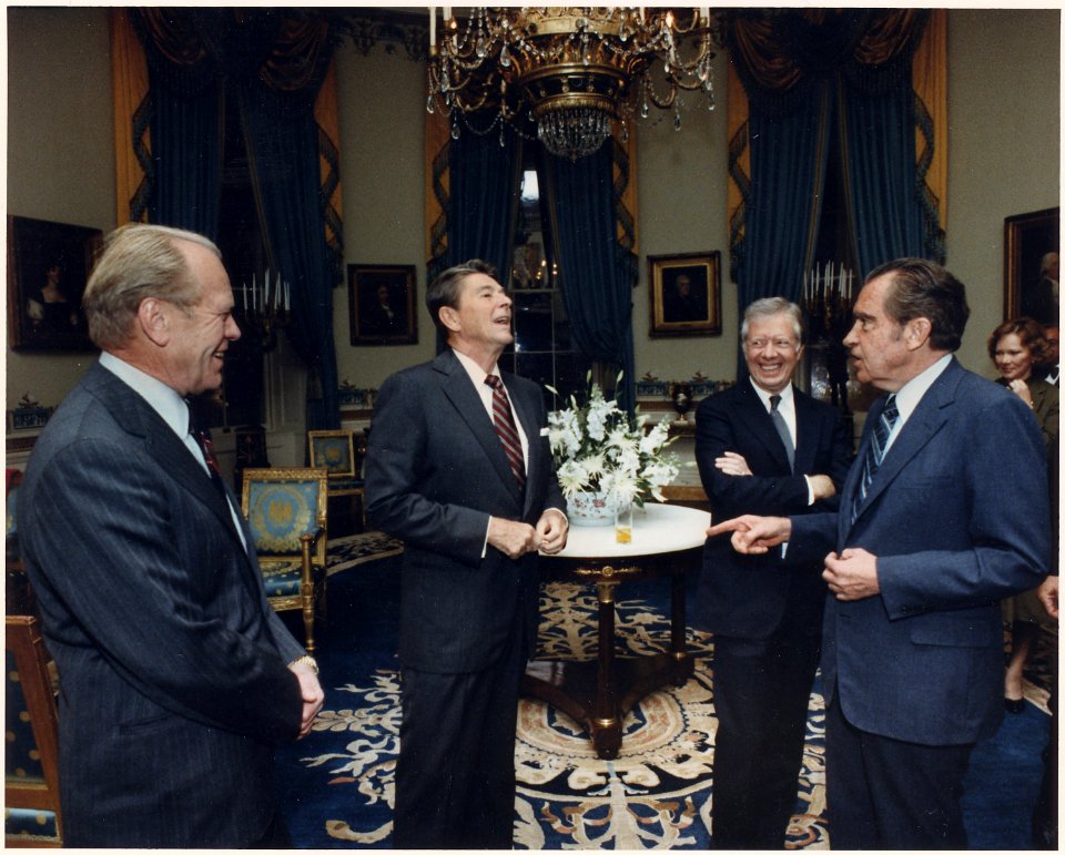 Photograph of the Four Presidents (Reagan, Carter, Ford, Nixon) in the Blue Room prior to leaving for Egypt and... - NARA - 198523