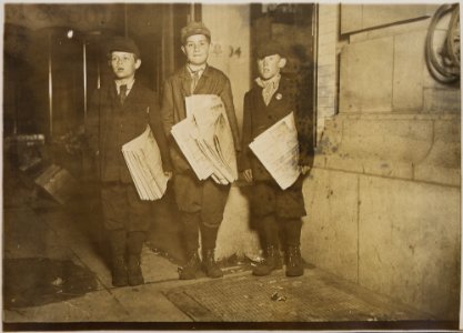 Photograph taken after midnight on April 17, 1912, G St. near 14th. These boys, 10, 11, and 12 years old, were stuck... - NARA - 306616