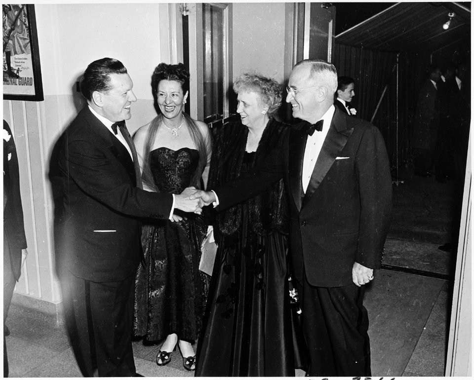 Photograph of the President and Mrs. Truman being greeted upon their arrival at the National Guard Armory in... - NARA - 200379
