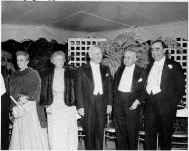 Photograph of the President and Mrs. Truman with Brazilian President Eurico Dutra and other dignitaries, in formal... - NARA - 200125