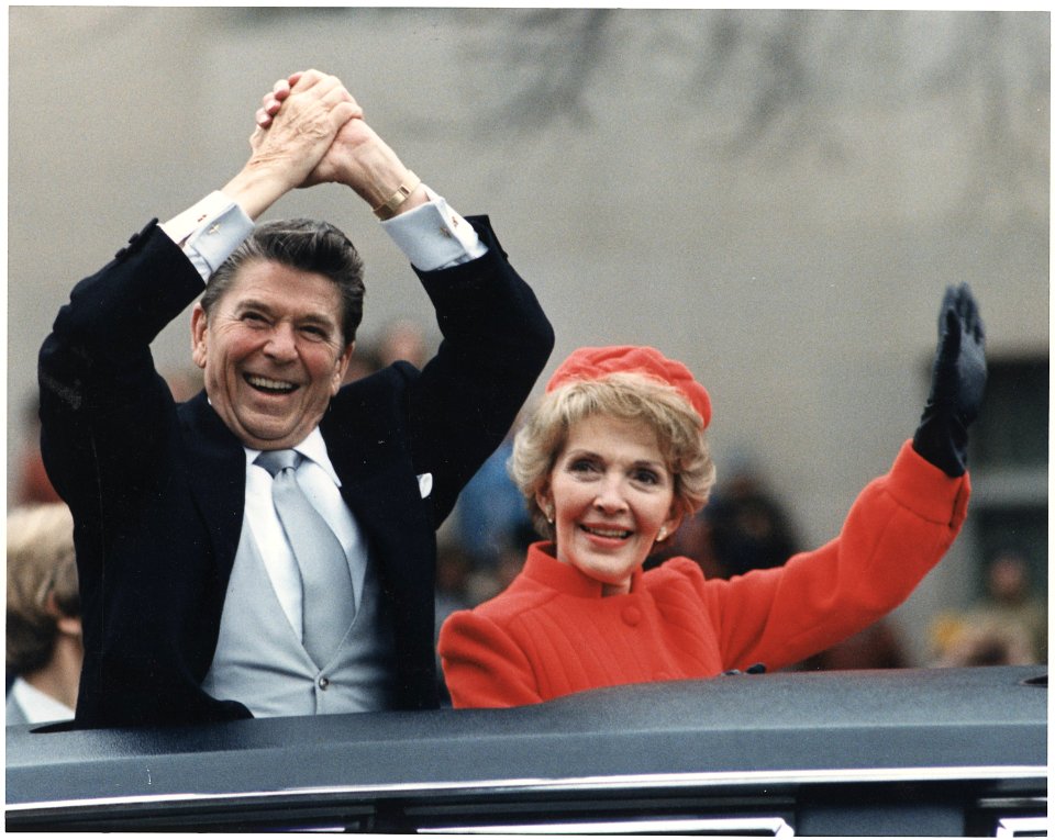 Photograph of The Reagans waving during the Inaugural Parade - NARA - 198507