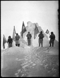 Photograph of the Robert Peary Sledge Party Posing with Flags at the North Pole - NARA - 542472 photo