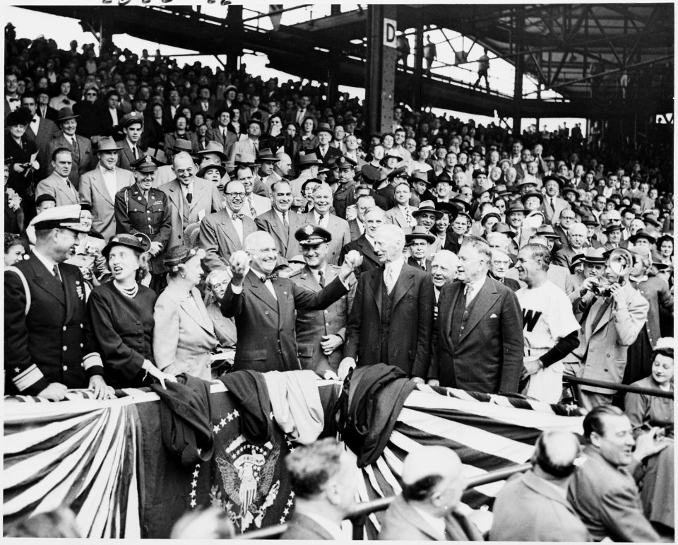 Photograph of President Truman holding up baseballs in both hands (the President was basically a southpaw but could... - NARA - 200203