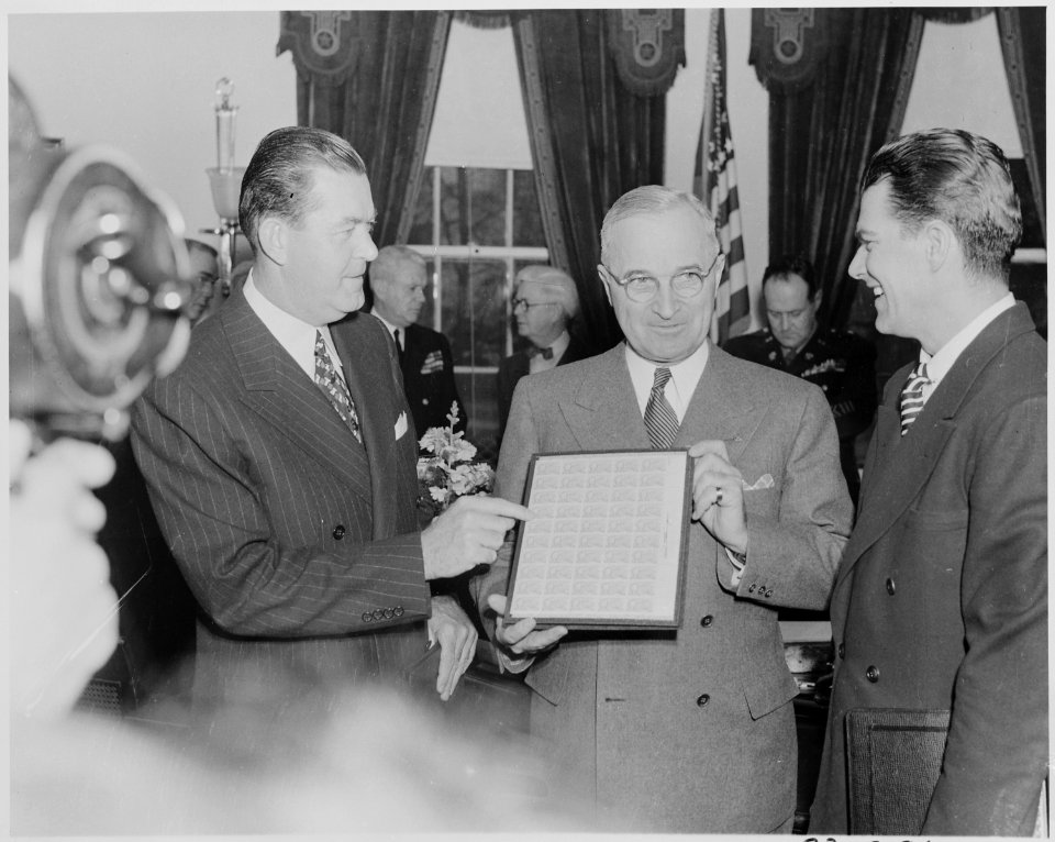 Photograph of President Truman receiving a set of stamps honoring the late President Franklin D. Roosevelt from... - NARA - 199346