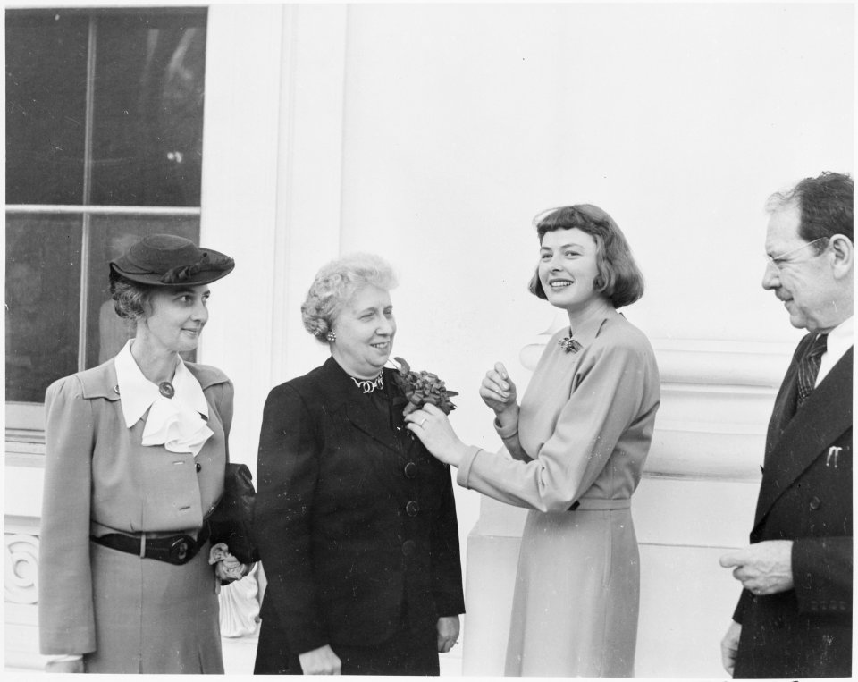 Photograph of First Lady Bess Truman receiving a community chest award and corsage from actress Ingrid Bergman, who... - NARA - 199439