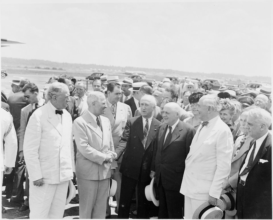 Photograph of President Truman shaking hands with Secretary of State James Byrnes just before Byrnes's departure for... - NARA - 199414